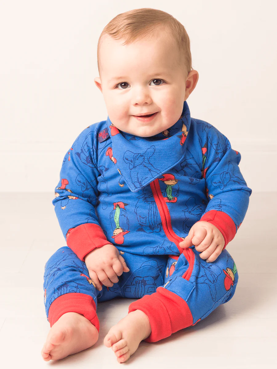 baby wearing Paddington romper
