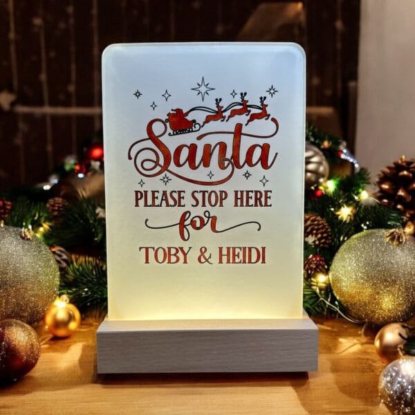 Light up acrylic Santa please stop here sign.